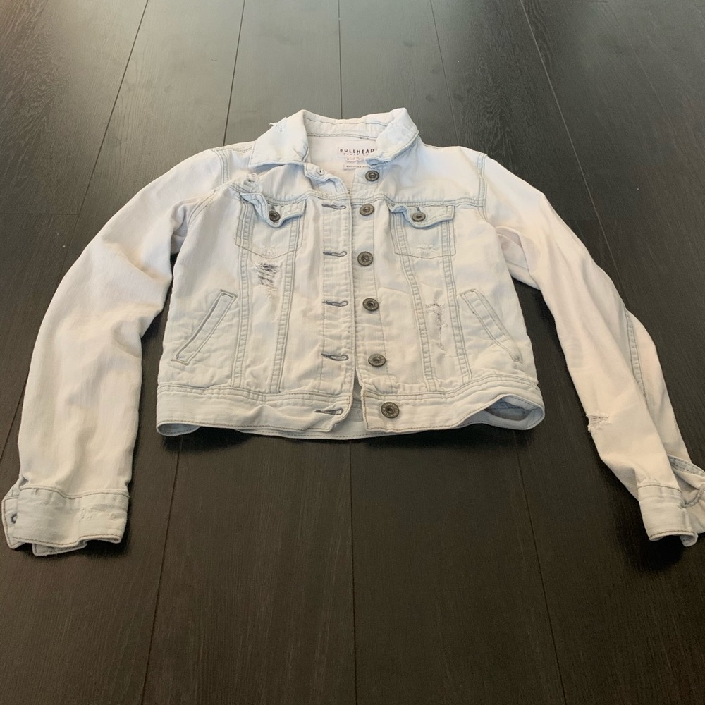 Light wash distressed denim jacket